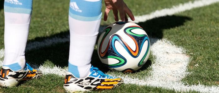 Lionel Messi of Argentina places the ball on the corner spot